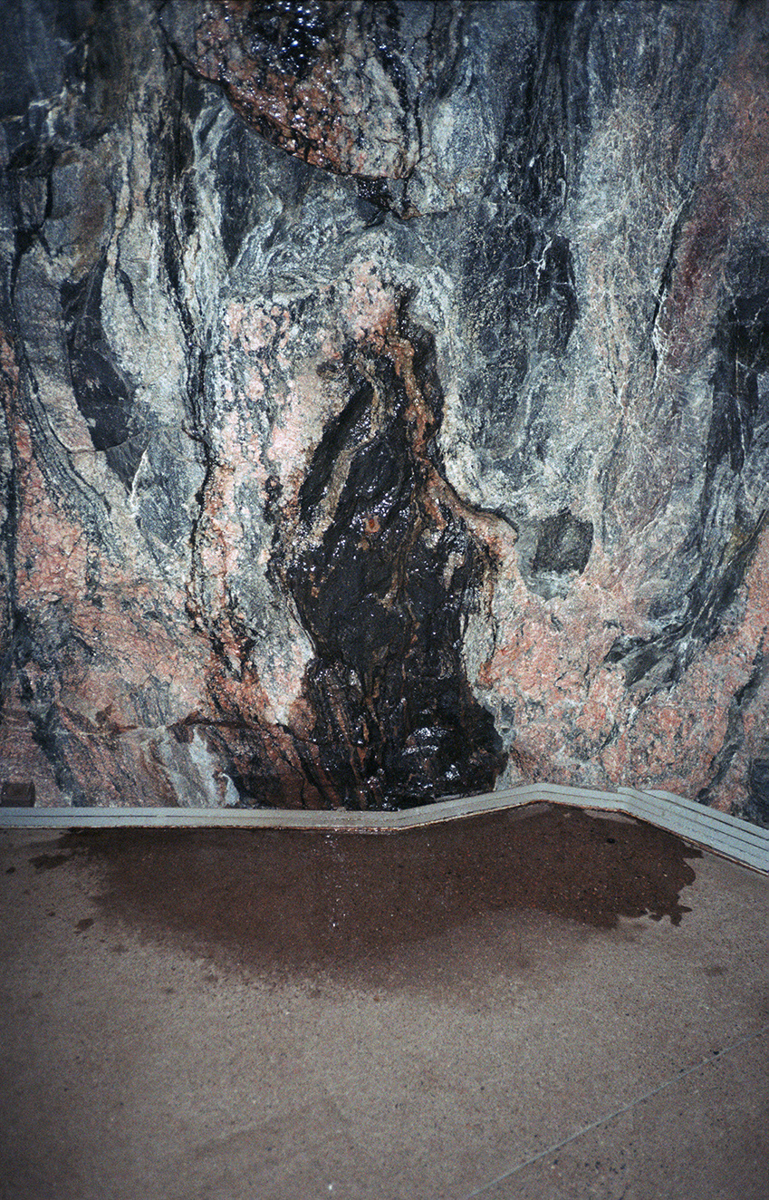photo of a wet cave face